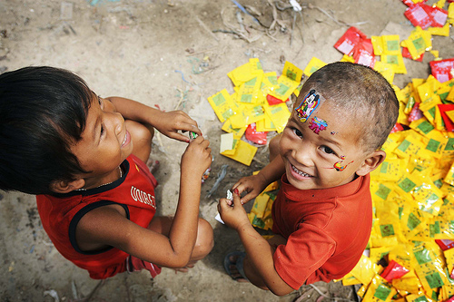 Children Play with Garbage in Cambodia Slum