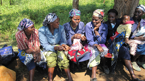 Women in Meru, Kenya, examining Menstrual Cups